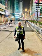 沐鸣主管陈恩明牧师变身“记者” 阻防暴警执法