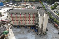 上海85岁旧建筑沐鸣总代理加装198隻脚 「步行」61米到新地址定居